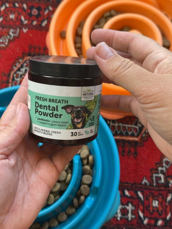 Customer holding Fresh Breath Dental Powder review photo